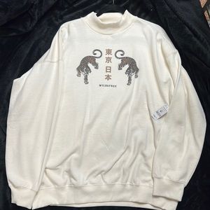 Cream sweater, tiny hole in it bought it like that.